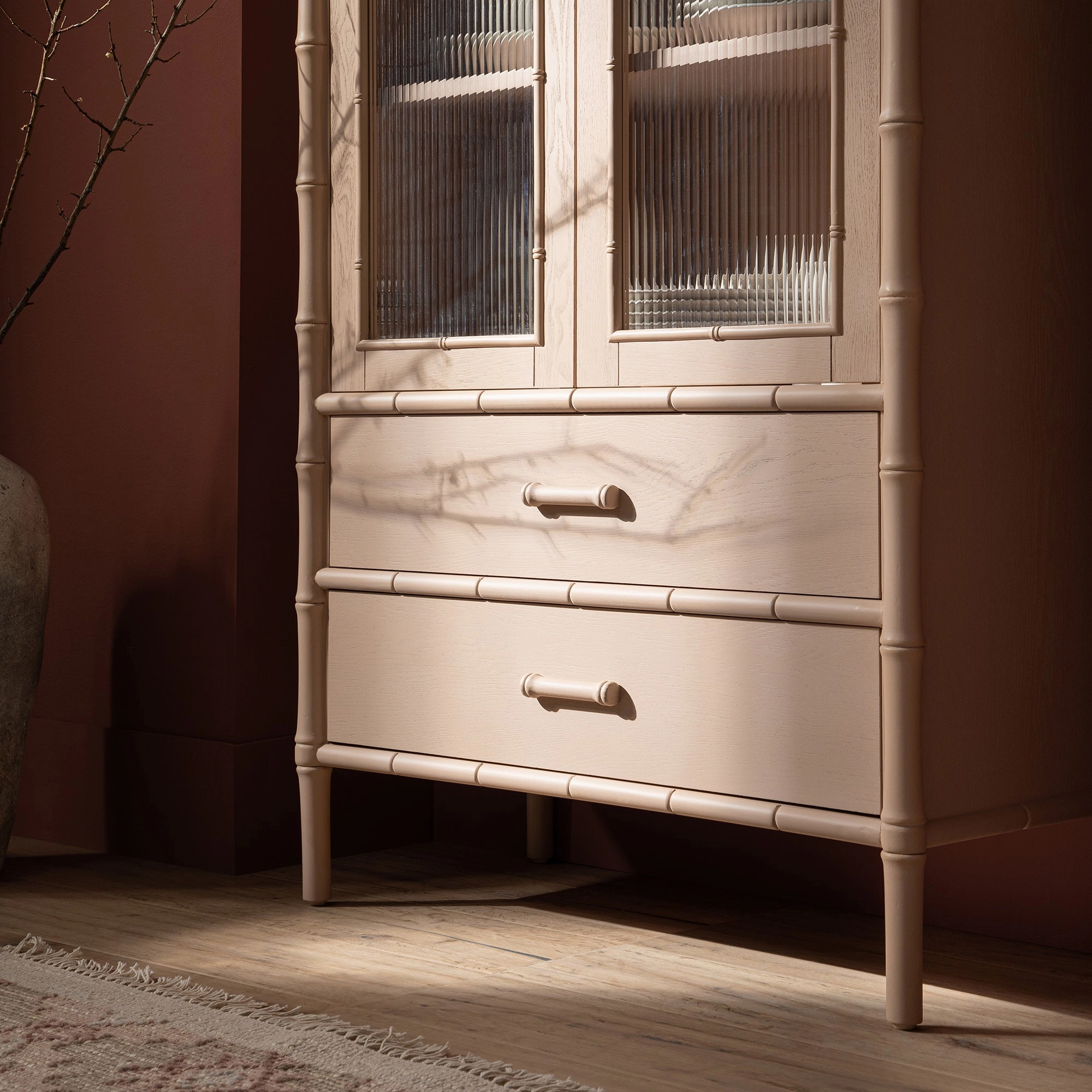 Elstowe Faux Bamboo and Fluted Glass 2-Door Cabinet, Nude Pink
